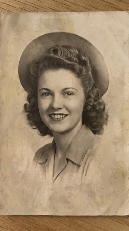 The same portrait after Aion's scratch repair: creases and stains gone, still black-and-white, detail intact